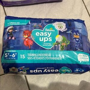 Pampers easy up brand new, taped on side but brand new